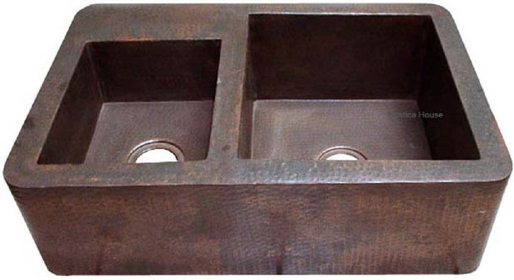 copper kitchen sink with apron and left bowl smaller