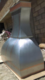 hadcrafted kitchen range hood made of smooth zinc