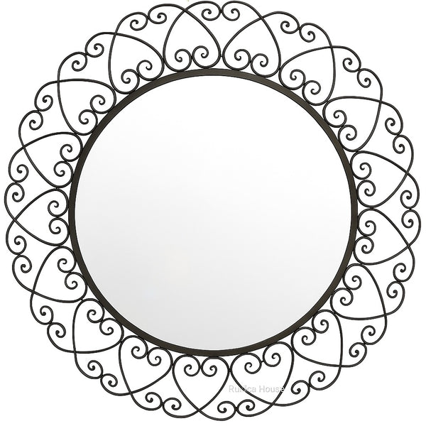Ornate Heart Wrought Iron Wall Mirror with a circular glass center surrounded by a decorative black iron frame featuring continuous heart and scroll motifs, creating an elegant handcrafted appearance.