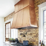 wall mount copper range hood for a kitchen