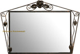 Rose Accent Wrought Iron Wall Mirror with a rectangular reflective surface framed by dark iron scrollwork, featuring a sculpted rose and leaf accents at the top and sides, combining floral artistry with handcrafted metal design.